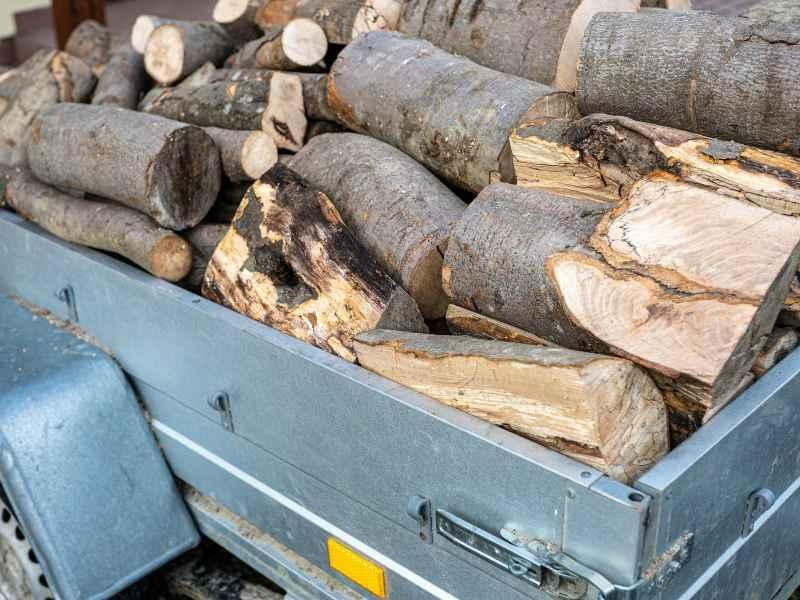 A 6X4 TRAILER LOADED WITH FIREWOOD