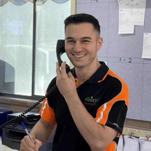 Daisys staff member on the phone assisting with sale