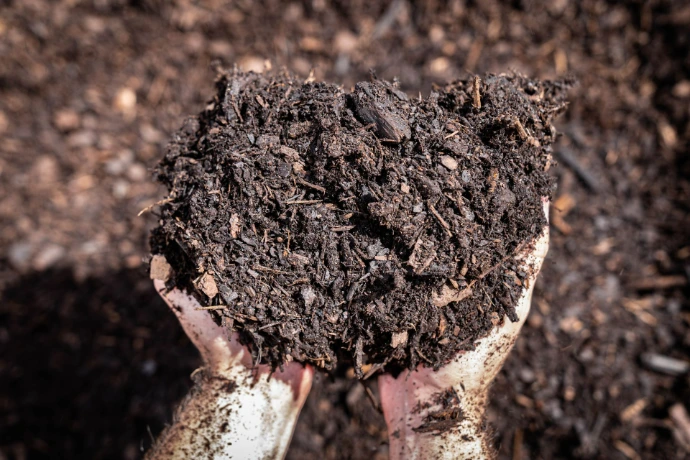 Hand displaying watersaver mulch